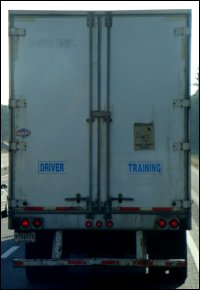 A truck driver training school van, so marked.