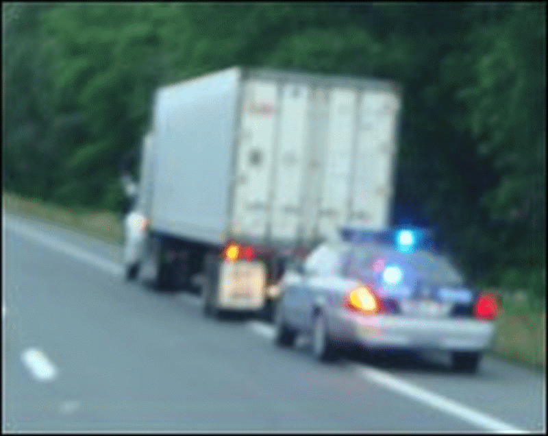 Big truck pulled over by law enforcement.