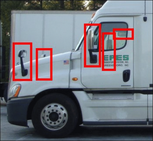 The red boxes are around the mirrors visible on this truck.