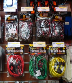 A display of stretch cords on sale at a truck stop.