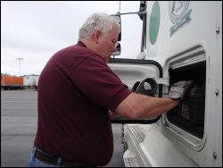 While wearing work gloves to protect his hands, Mike pulled The Enforcer out of the tool box from his truck's side box.