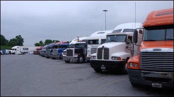Trucks parked at a truck stop.