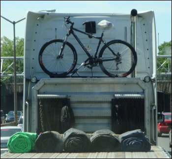 The position of the trucker back on the rack is such that it is protected from the wind by the height of the tractor.