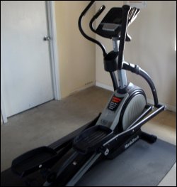 An elliptical trainer at a truck stop gym.