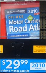 A Deluxe Motor Carriers Road Atlas -- a truckers atlas with spiral binding and laminated pages.