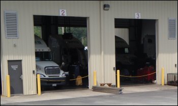 Close-up of two shop bays at a trucking company.