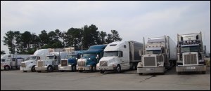 Large trucks at a truckstop.