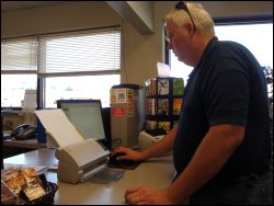 Professional driver Mike Simons transmitting the paperwork from a load he has delivered to his trucking company by TransFlo.