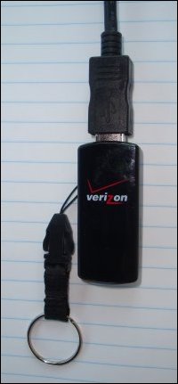 Verizon Wireless Mobile Broadband modem plugged into USB extension cable.