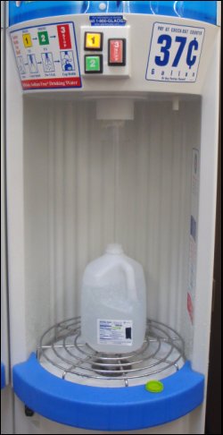 A water vending machine at a Wal-Mart Supercenter that has button delivery.