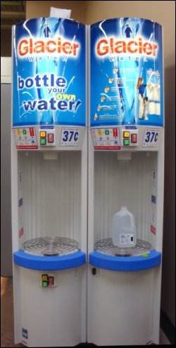 Water vending machines at a Wal-Mart Supercenter in which customers can refill one-gallon water jugs for $0.37 each.