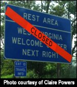 Sign showing a closed rest area.