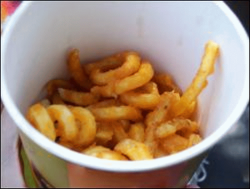 Curly fries in a cup.