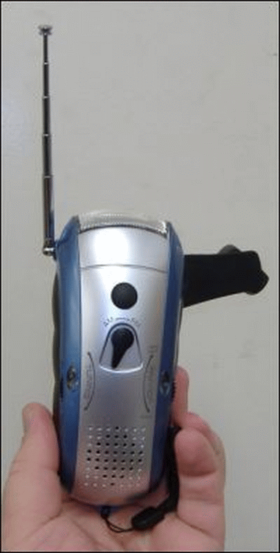 A crank handle rechargeable flashlight with a radio.