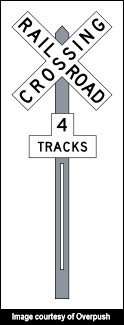 Image of railroad crossing sign with 4 tracks notation.