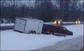A vehicle that slid off the road in the snow.