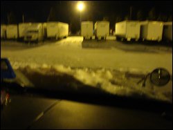 A night-time photo of heavy snow accumulation in a trucking terminal in Greenboro, NC, after a heavy snow.