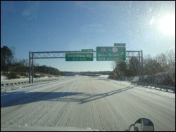 A view of a practically deserted major road in North Carolina following a heavy snowfall.