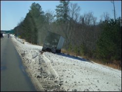 A commercial motor vehicle that slid off the road during a heavy snowfall.