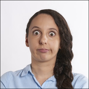 Woman with braid is in a state of disbelief.