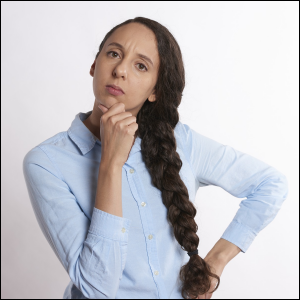 Woman with braided hair contemplating and thinking.