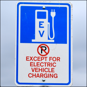 Electric truck battery charging station sign.